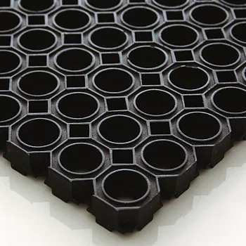 Alfombra alveolar de goma negra con huecos octogonales
